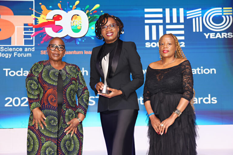 Dr Rachael Dangarembizi (middle) accepts her TW Kambule-NSTF Award for Emerging Researcher at the gala dinner. She is pictured with (from left to right) the Deputy Minister of Science, Technology and Innovation, Ms Nomalungelo Gina and Dr Avela Majavu, co-chair of the South African Young Academy of Science.