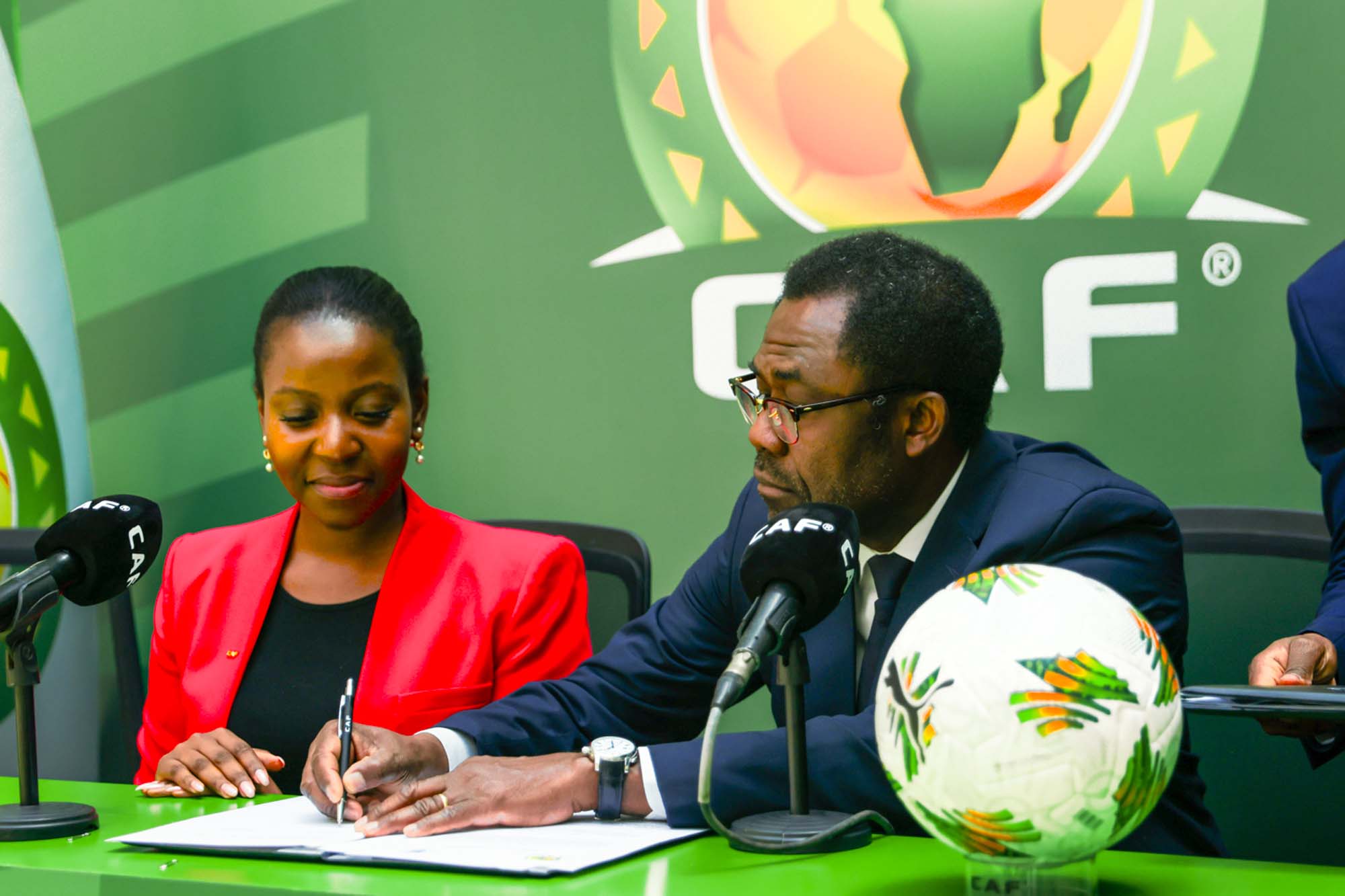 CAF Secretary General, Mr Veron Mosengo-Omba, signing the MoU.