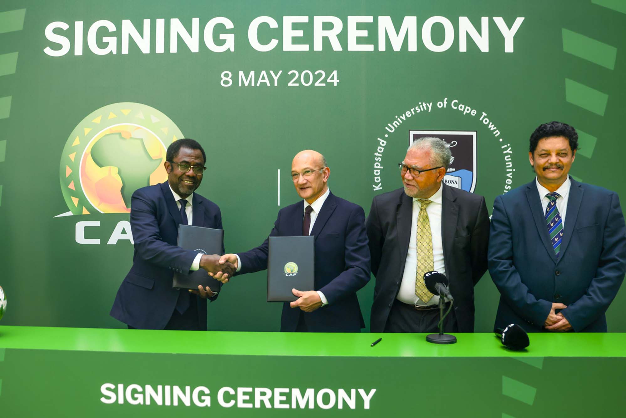 CAF Secretary General, Mr Veron Mosengo-Omba, and University of Cape Town (UCT) Vice-Chancellor interim, Professor Daya Reddy, shaking hands after signing the MoU.