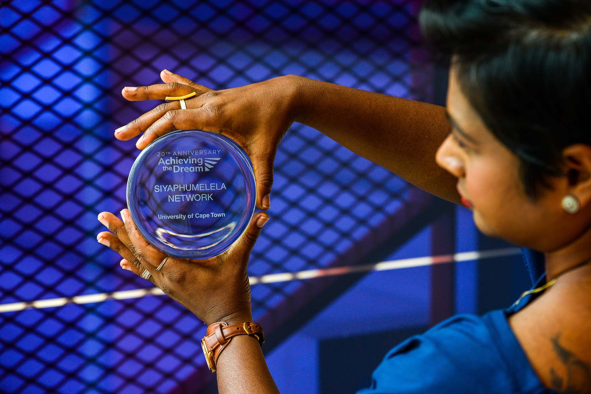 Riashna Sithaldeen holds the Siyaphumelela network award.